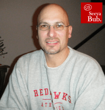 dad-in-redhawks-sweater-with-sb-logo