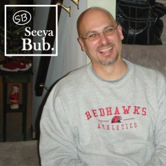 Dad Smiling Against Stairs