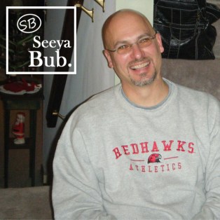 Dad Smiling Against Stairs