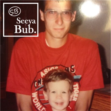 Sitting in Dad's Lap with SB Logo