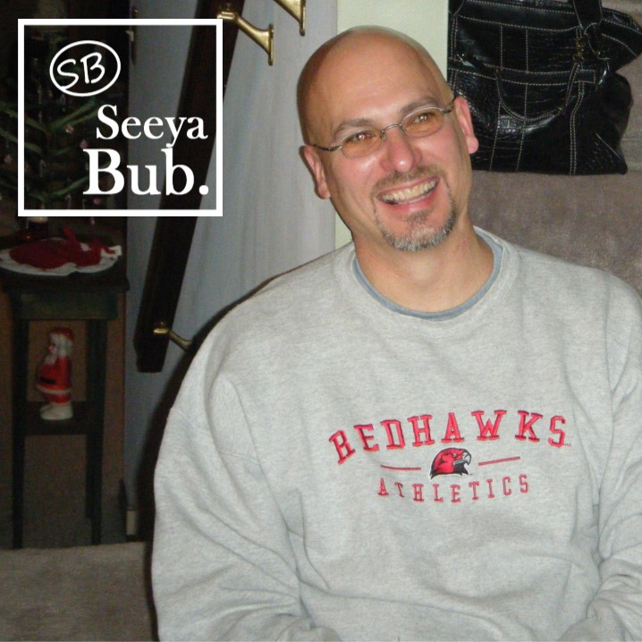Dad Smiling Against Stairs