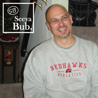 Dad Smiling Against Stairs